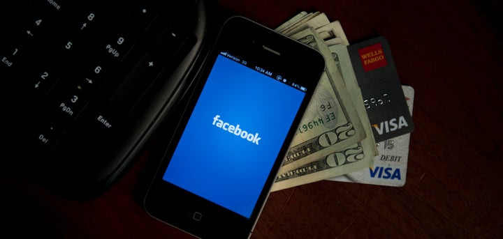 A view of and Apple iPhone displaying the Facebook app's splash screen May 10, 2012 in Washington, DC. Social-networking gia