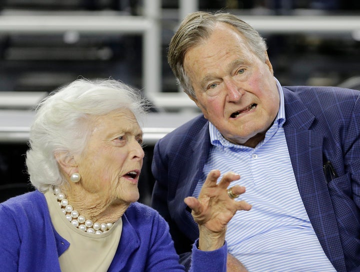 FILE- In this March 29, 2015, photo, former President George H.W. Bush and his wife Barbara Bush speak before the first half