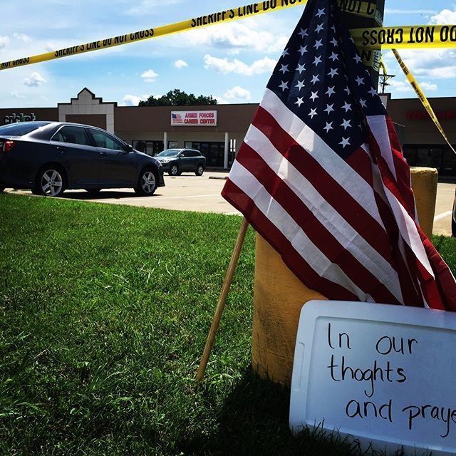 A memorial is set up at the Armed Forces recruiting center on Lee Highway in Chattanooga, Tennessee on July 16, 2015.