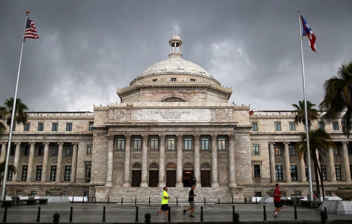 SAN JUAN, PUERTO RICO - JULY 01: The Puerto Rican Capitol building is seen as the island's residents deal with the government's $72 billion debt on July 1, 2015 in San Juan, Puerto Rico. Governor of Puerto Rico Alejandro GarcÃa Padilla said in a speech recently that the people of Puerto Rico will have to make sacrifices and share the responsibilities to help pull the island out of debt. (Photo by Joe Raedle/Getty Images)