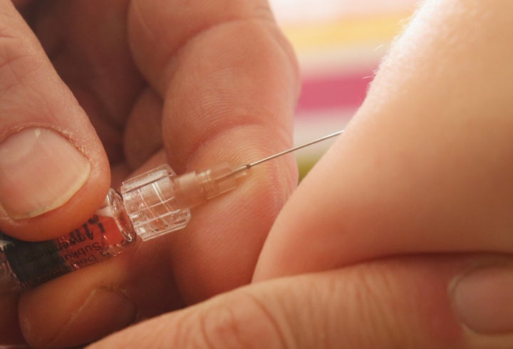 BERLIN, GERMANY - FEBRUARY 26: A children's doctor injects a vaccine against measles, rubella, mumps and chicken pox to an infant on February 26, 2015 in Berlin, Germany. The city of Berlin is facing an outbreak of measles that in recent weeks has led to over 700 cases and one confirmed death of a little boy who had not been vaccinated. Vaccination in Germany is not compulsory by law though the vast majority of parents have their children vaccinated. (Photo by Sean Gallup/Getty Images)