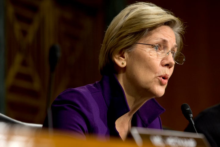 Sen. Elizabeth Warren, D-Mass., asks a question of Janet L. Yellen, of California, Presidential nominee for Chairman of the Board of Governors of the Federal Reserve System, at a hearing of the Senate Banking, Housing and Urban Affairs committee examining Yellen's nomination, on Capitol Hill in Washington, Thursday Nov. 14, 2013. (AP Photo/Jacquelyn Martin)