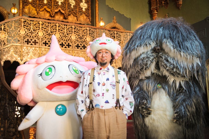 Director Takashi Murakami poses with characters from JELLYFISH EYES