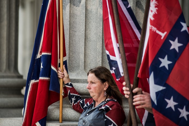 COLUMBIA, SC - JULY 6: Confederate flag supporters gather at the state house July 6, 2015 in Columbia, South Carolina. The state legislature began debate on the placement of the flag today after the issue was reignited by the murders in Charleston, South Carolina at Emanuel AME Church in June. (Photo by Sean Rayford/Getty Images)