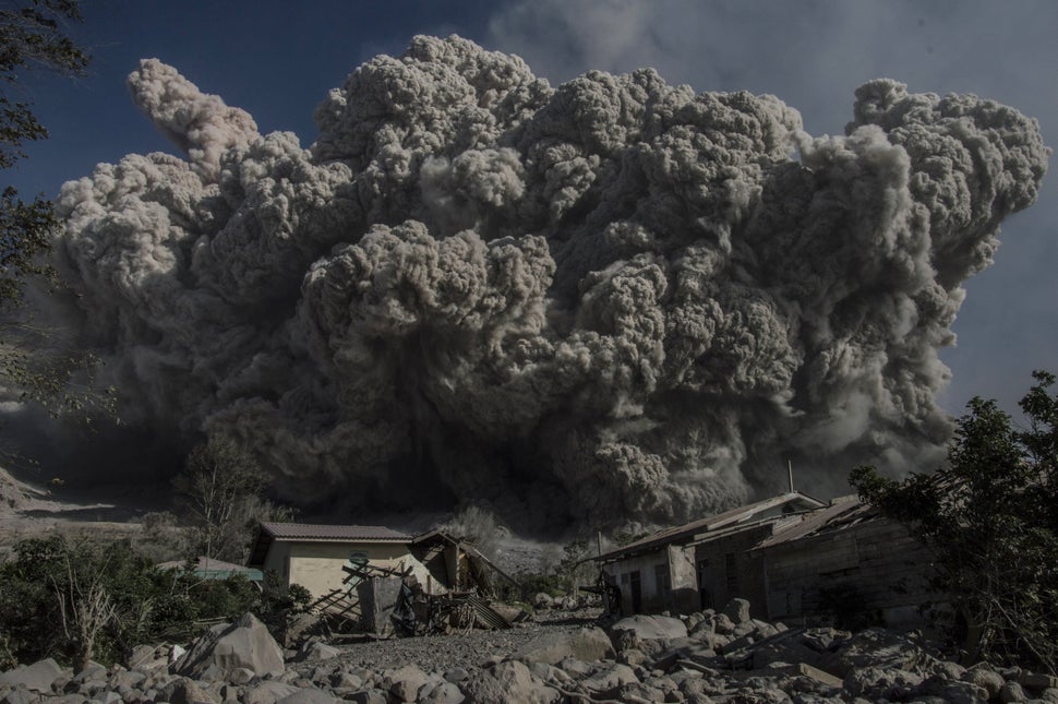 Mount Sinabung volcano spews giant volcanic ash in Karo, North Sumatra on June 25, 2015. Sinabung is one of 129 active volcanoes in Indonesia, which sits on the Pacific Ring of Fire, a belt of seismic activity running around the basin of the Pacific Ocean. AFP PHOTO / SUTANTA ADITYA (Photo credit should read SUTANTA ADITYA/AFP/Getty Images)