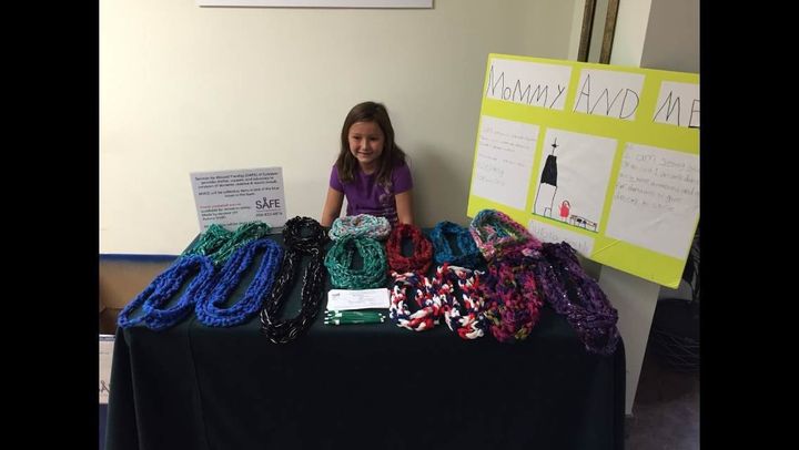 Aurora Smith sells scarves as part of her "Mommy And Me" initiative.