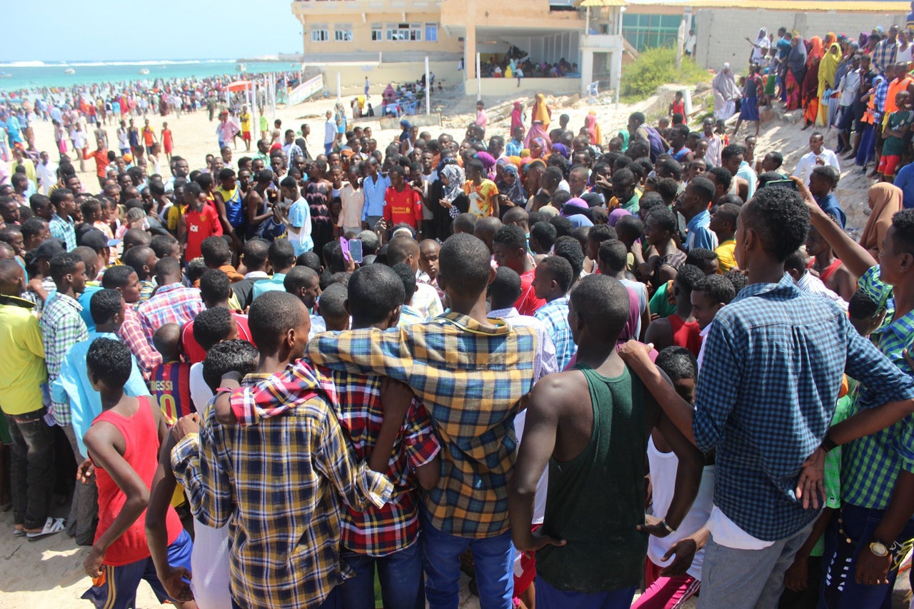 Young men gather to watch an improv dance competition on Eid.