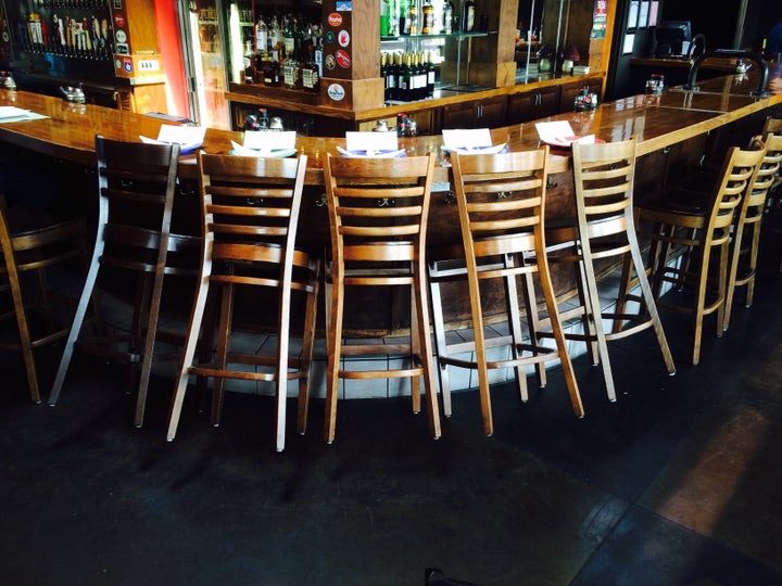 Bar stools were set aside at the downtown Chattanooga Mellow Mushroom location for those who died after the shooting. 