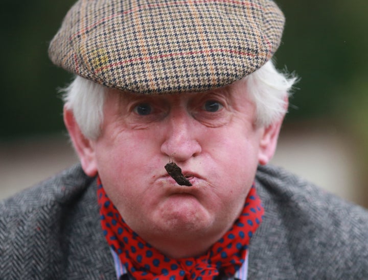 <p>Liam Leonard spits sheep dung at the Lady of the Lake festival on July 17, 2015.</p>