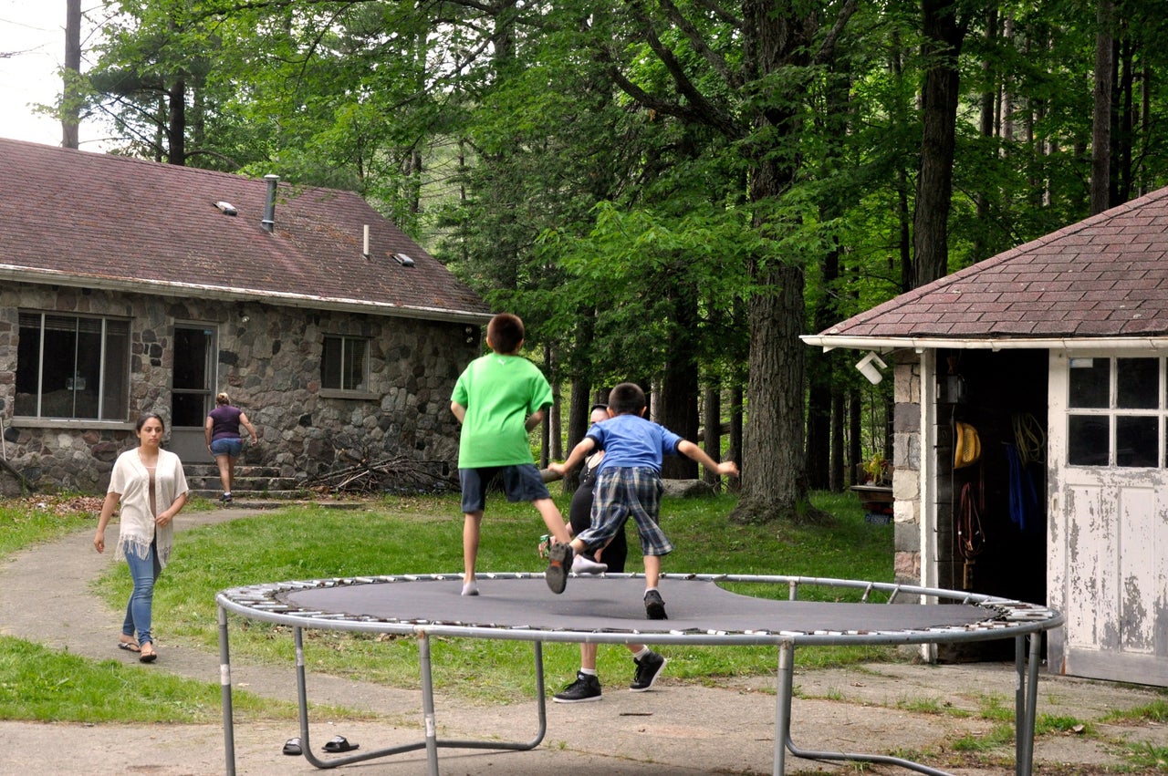 <p>Two kids bounce on the trampoline at David Salha's property in Lupton, Michigan.</p>