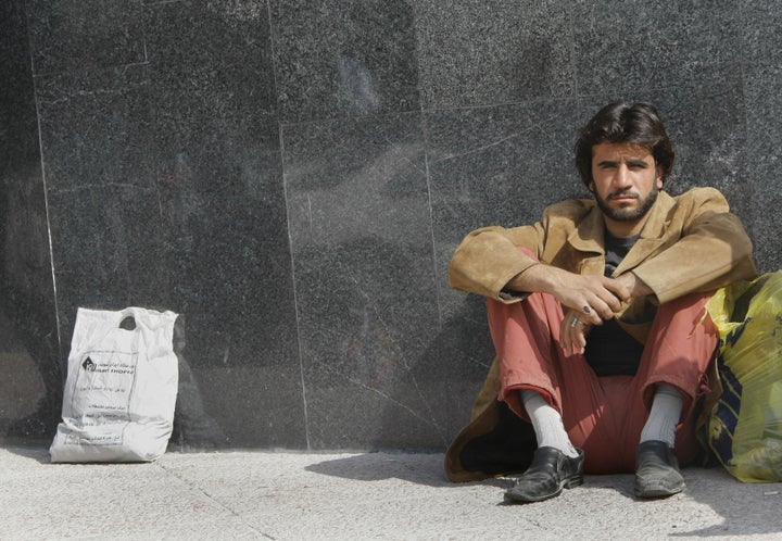 An Iranian temporary manual worker waits for work in Tehran on March 11, 2008. 