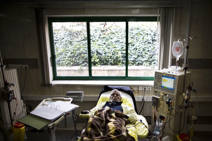 <span>An Iranian man receives treatment at the dialysis ward at the Helal Iran Clinic in Tehran on March 11, 2015.<