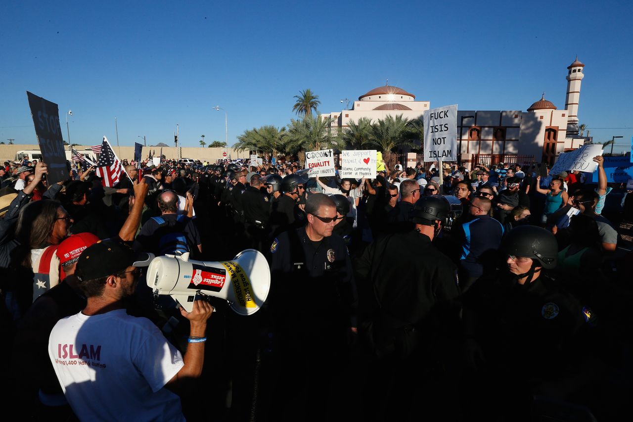 Protesters and counter-protesters rally outside the Islamic Community Center on May 29, 2015 in Phoenix, Arizona. Crowds gathered in response to a planned "freedom of speech" demonstration where attendees were encouraged to bring weapons and "draw Muhammed." 