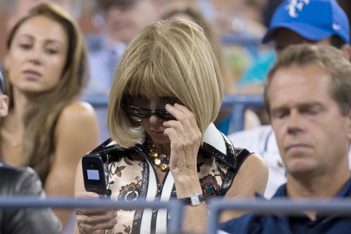 Anna Wintour on her flip phone at the U.S. Open last year.