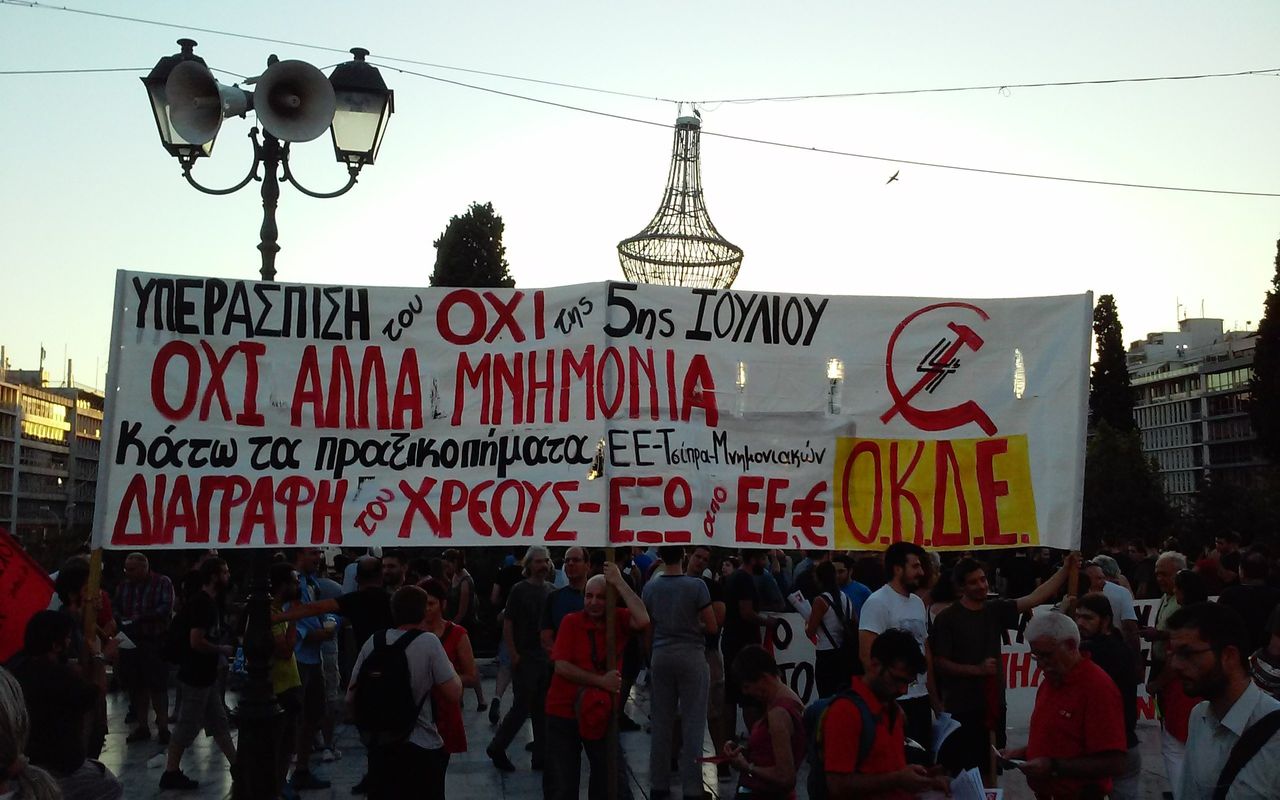 Demonstrators in Athens hold a banner protesting austerity measures on July 22, 2015.