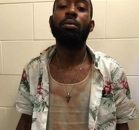 <p>Thomas Jennings, 24, wearing a blood-stained undershirt.</p>