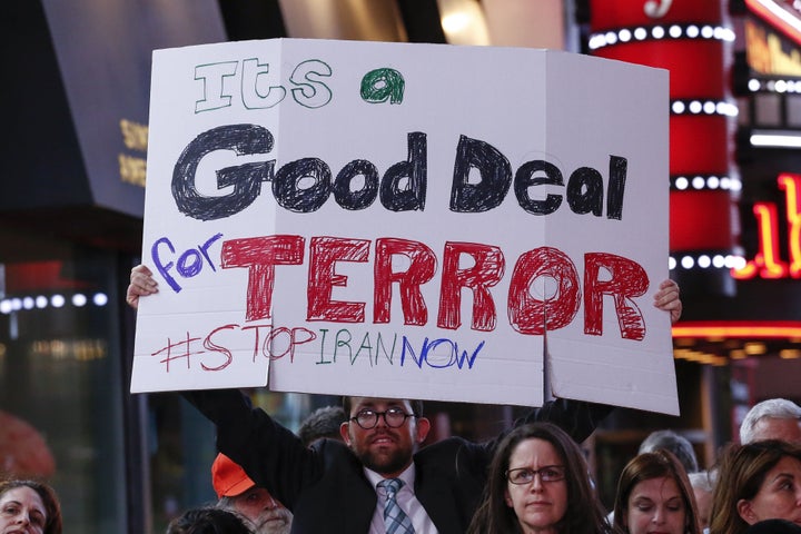 A protester holds a sign at the rally.