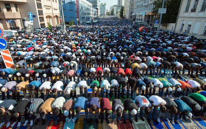 Russian Muslims pray outside the central mosque in Moscow on July 17, 2015, during celebrations of Eid al-Fitr marking the end of the fasting month of Ramadan. AFP PHOTO / DMITRY SEREBRYAKOV (Photo credit should read DMITRY SEREBRYAKOV/AFP/Getty Images)