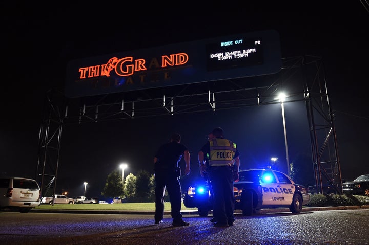 Police outside the Lafayette, Louisiana, movie theater where a shooting occurred Thursday night.