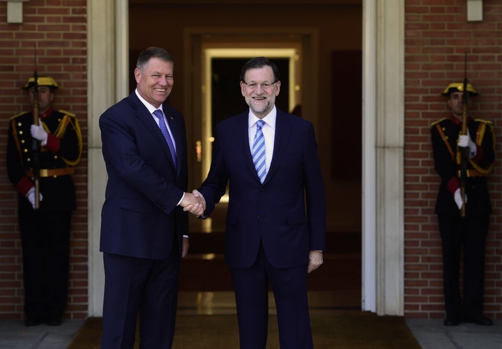 Spanish Prime Minister Mariano Rajoy, right, shakes hands with Romanian President Klaus Iohannis prior to a meeting at La Moncloa palace in Madrid on July 13, 2015. Romanians make up the largest group of foreigners in Spain, which has led some to be wary of the eurozone's austerity policies.