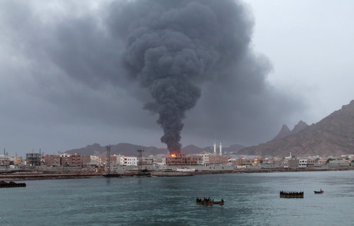 <span>Fire and smoke rises from the Aden oil refinery following a reported shelling attack by Houthi rebels in the embattled