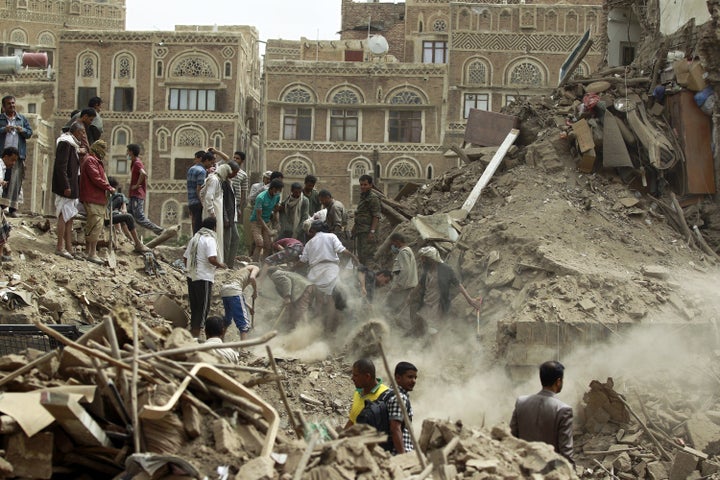 Yemenis search for survivors under the rubble of houses in the UNESCO-listed heritage site in the old city of Yemeni capital Sanaa, on June 12, 2015 following an overnight airstrike. 