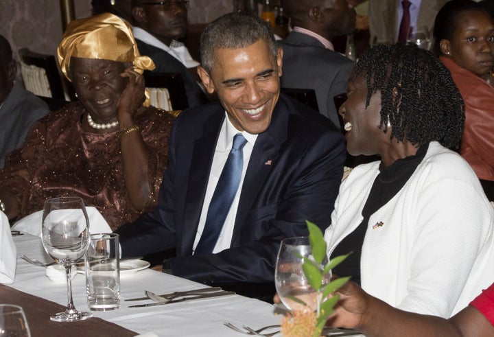 President Barack Obama sits alongside his step-grandmother, Mama Sarah (L) and half-sister Auma Obama (R), during a gathering of family at his hotel in Nairobi, Kenya, July 24, 2015. Obama arrived in the Kenyan capital Nairobi late Friday, making his first visit to the country of his father's birth since his election as president. Obama was greeted by Kenyan President Uhuru Kenyatta with a handshake and embrace as he stepped off Air Force One, at the start of a weekend visit during which he will address an entrepreneurship summit and hold talks on trade and investment, counter-terrorism, democracy and human rights.