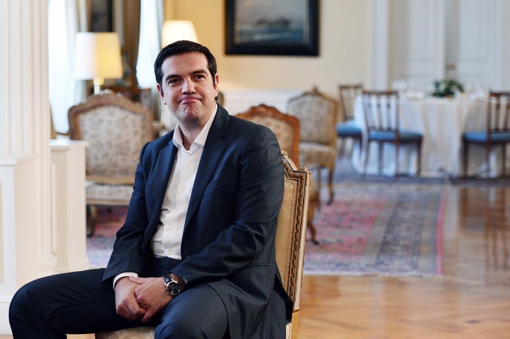 Greece's Prime Minister Alexis Tsipras attends a meeting with Greek President and Greek political parties leaders, ahead of a dinner hosted by the president to mark the 41st anniversary of the country's return to democracy after the 1974 fall of the military junta, at the presidential palace in Athens on July 24, 2015.