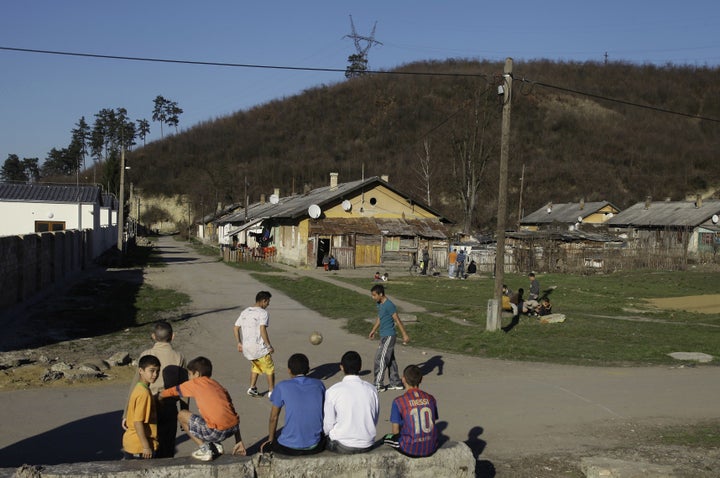 <span>Roma children play ball in Ozd, northern Hungary on March 14, 2014.</span>