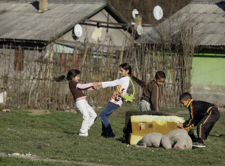 Roma children play in Ozd, northern Hungary on March 14, 2014.