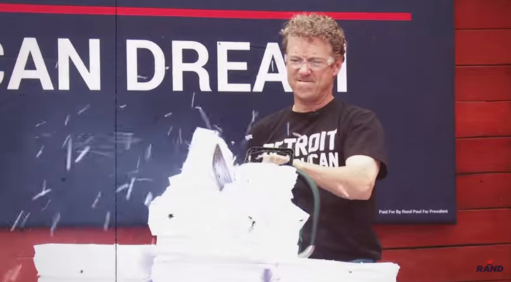 Sen. Rand Paul (R-Ky.) went at a copy of the U.S. tax code with a chain saw, fire and a wood-chipper. 