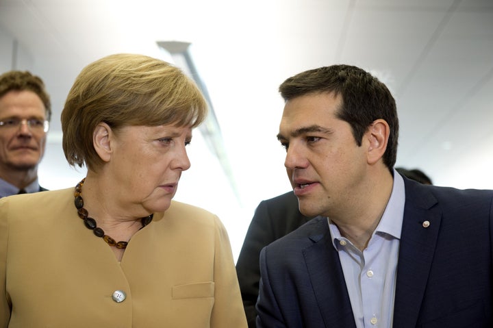 <p>German Chancellor Angela Merkel (L) and Greek Prime Minister Alexis Tsipras (R) speak during negotiations over Greece's new bailout package earlier this month.</p>