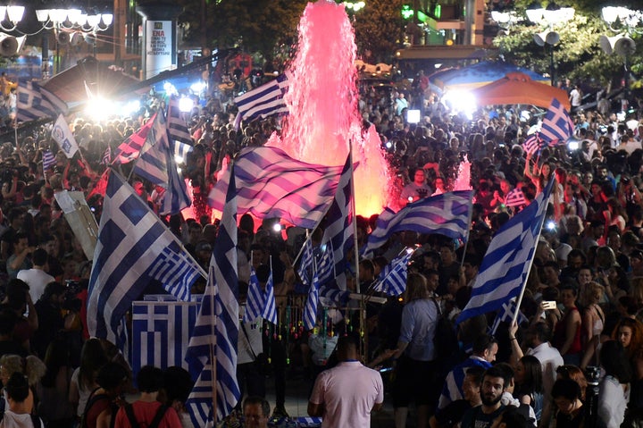 <p>Greek citizens celebrate the victory for the "no" vote in Greece's July 5 referendum on a new bailout deal from Greece's creditors. Despite hopes that the vote would strengthen the Greek government's hand at the negotiating table, Greece's government ended up accepting a deal that was more austere than the one voters rejected in the referendum.</p>