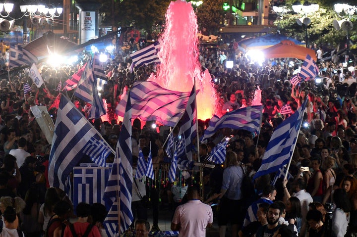 Greek citizens celebrate the victory for the "no" vote in Greece's July 5 referendum on a new bailout deal from Greece's creditors. Despite hopes that the vote would strengthen the Greek government's hand at the negotiating table, Greece's government ended up accepting a deal that was more austere than the one voters rejected in the referendum.