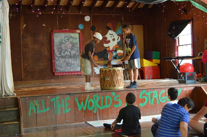 <p>Campers show off their drumming skills.</p>