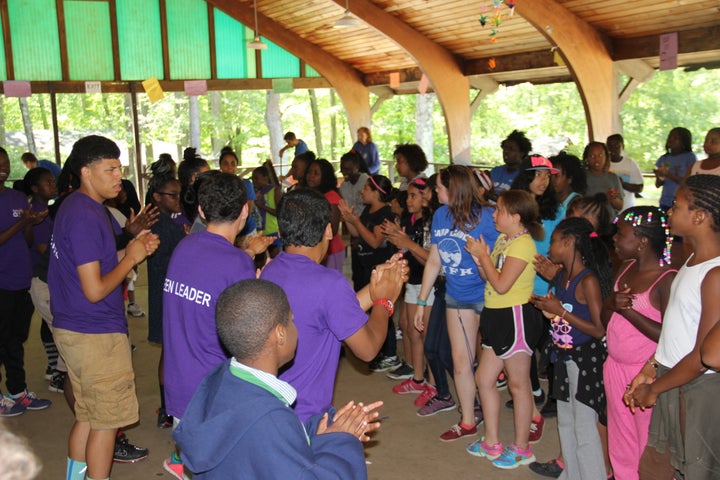 <p>Campers sing a lunchtime song.</p>