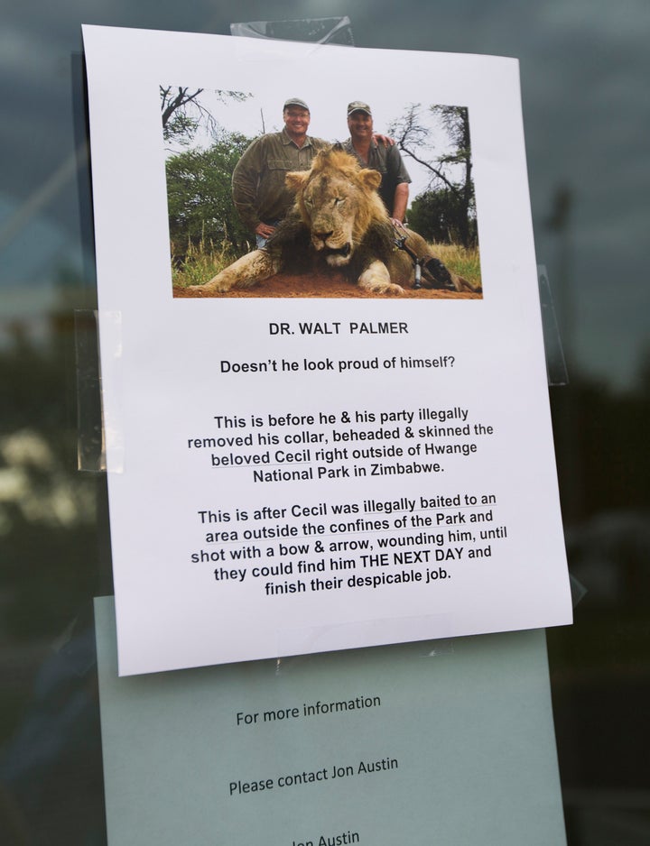 <p>A sign posted on the door of Walter Palmer's dental practice on July 28, 2015.</p>