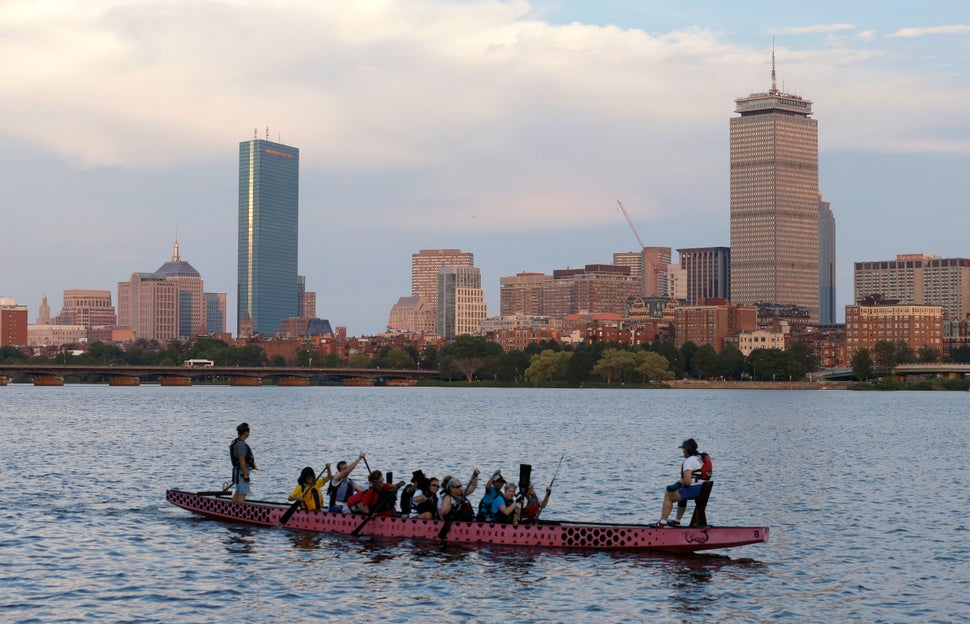 A boat glides down the Charles River, which may have hosted Olympic events, as Boston's bid to host the 2024 games died