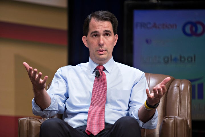 <p>Scott Walker speaks during a private gathering of influential Republican donors hosted by the Koch brothers.</p>