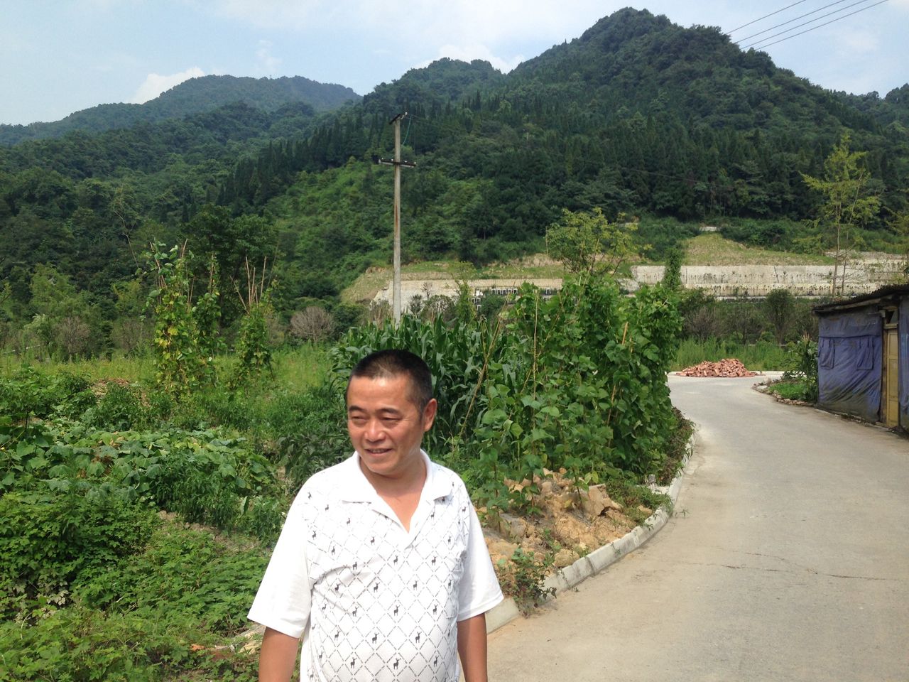 Huang Qi visiting the area affected by the 2008 Wenchuan earthquake.