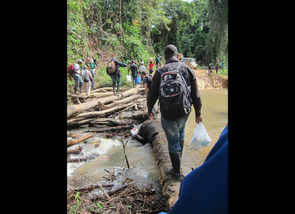 Photo credit: Justin Williams/CDC 

Sometimes the road to a village is not just a dirt path, but a log path as well. Here, a 