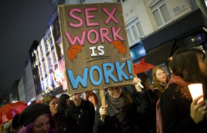 <p>London protesters march through Soho after a candle-lit vigil to mark the international day to end violence against sex workers, organized by the English Collective of Prostitutes.</p>