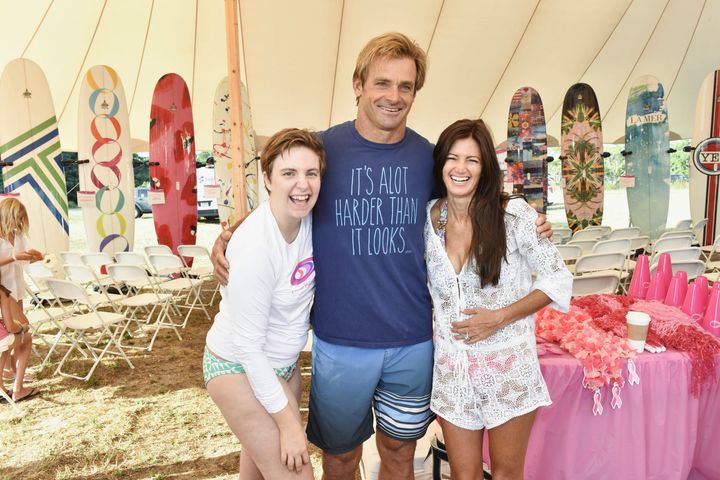 Lena Dunham, Laird Hamilton, and Maria Baum pose for a photo at the Paddle For Pink Fundraiser.