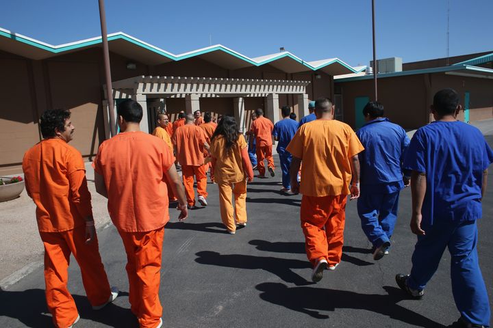 Immigrant detainees walk through the Immigration and Customs Enforcement detention facility on Feb. 28, 2013, in Florence, Arizona. Many Latino groups and immigrant rights organizations criticized Jeb Bush's immigration proposal for failing to address in detail the status of undocumented people living in the country.