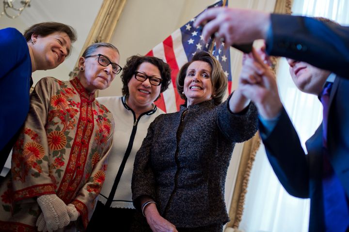 From left: Supreme Court Justices Elena Kagan, Ruth Bader Ginsburg and Sonia Sotomayor take a photo with House Minority Leader Nancy Pelosi (D-Calif.) in March.