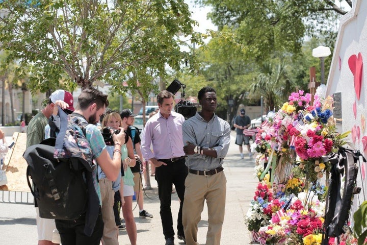 <span>E:60 correspondent Bob Woodruff stands behind Chris Singleton at the memorial to the Charleston shooting victims.</span