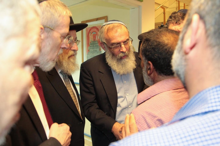 Rabbis meet with Ahmad's grandfather.