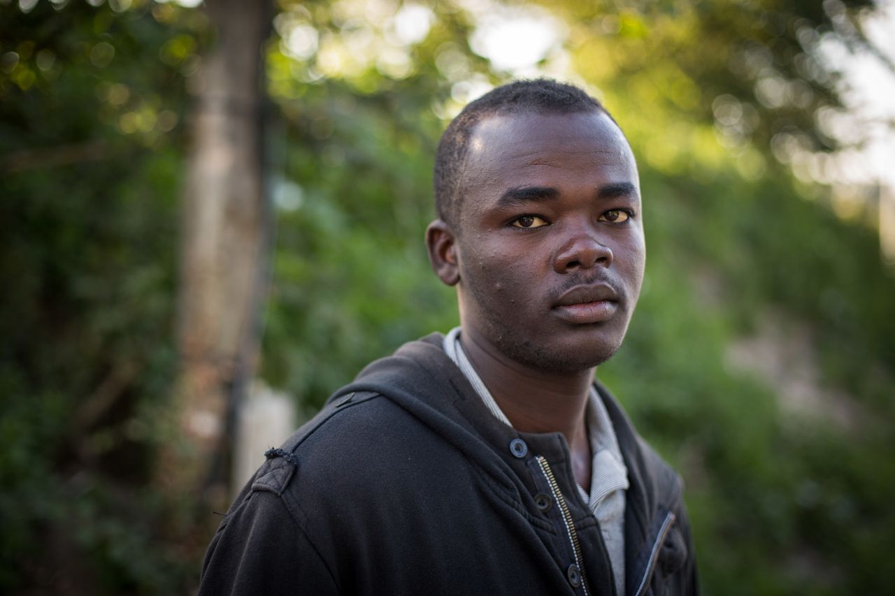 Kasam from the Darfur region of Sudan poses for a portrait in Calais on Aug. 2, 2015. 