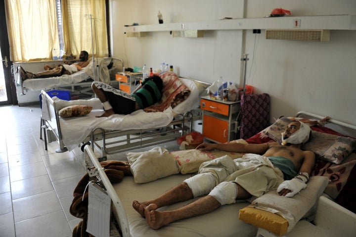 Yemeni men injured in Saudi-led coalition airstrikes at Al-Thawra Hospital in Sanaa, Yemen, on Aug. 1, 2015. 