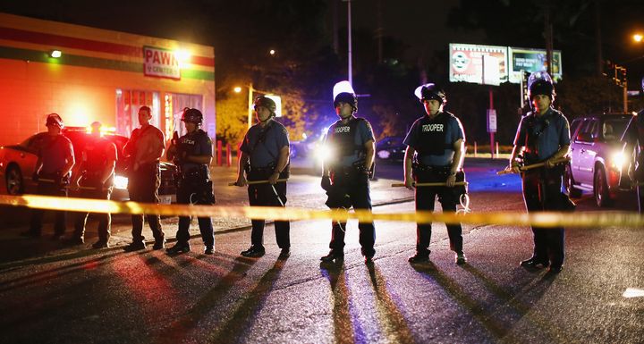 Law enforcement block of a street in Ferguson during protests in the days after the death of Michael Brown.